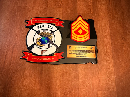 Decorative plaque with insignia and text on a wooden surface